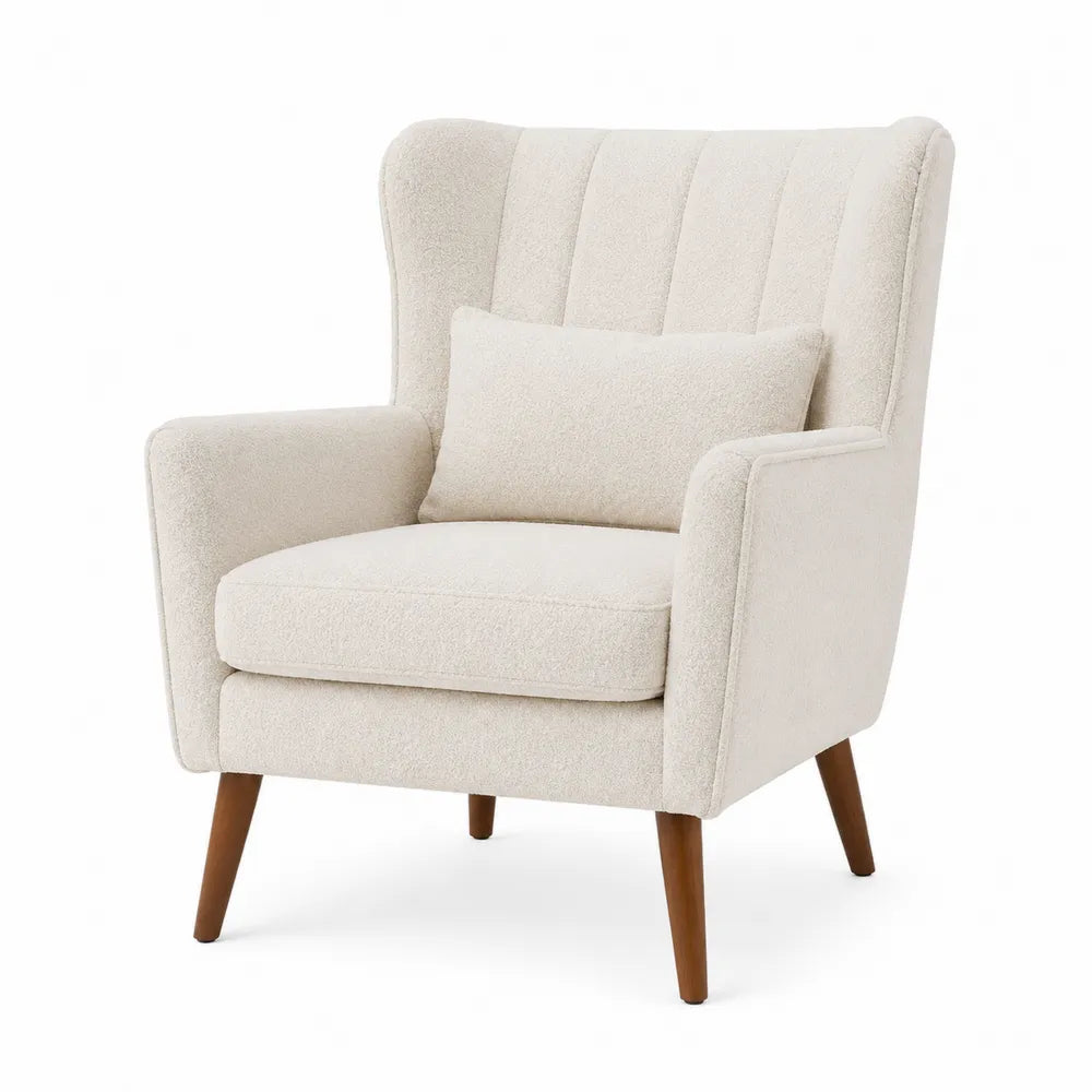Poltrona in tessuto bouclé beige con schienale trapuntato cuscino decorativo e gambe in legno massello stile moderno
